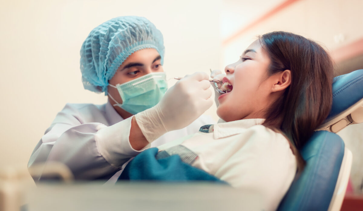 Woman having teeth examined with Tulsa Dentist