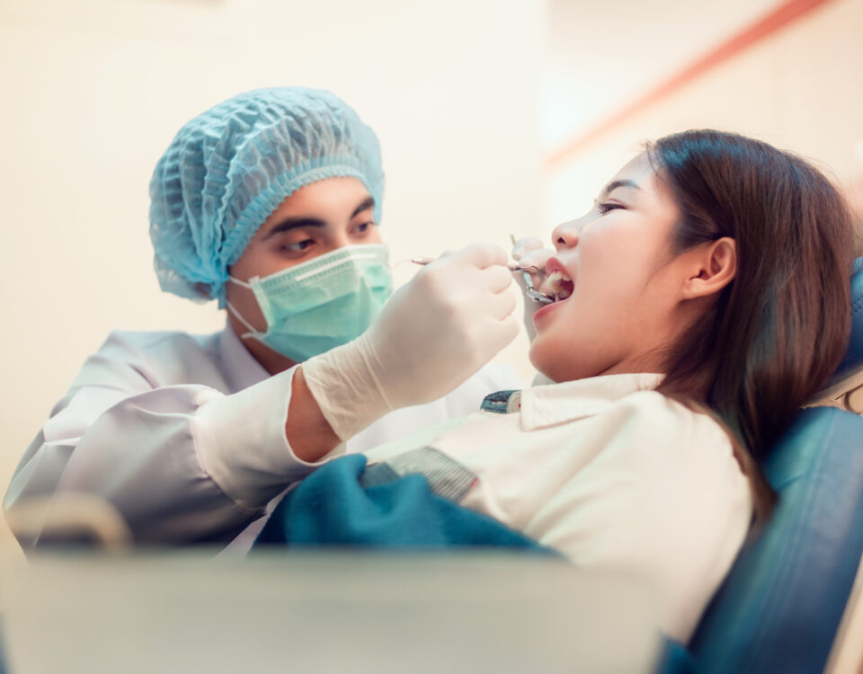 Woman having teeth examined with Tulsa Dentist